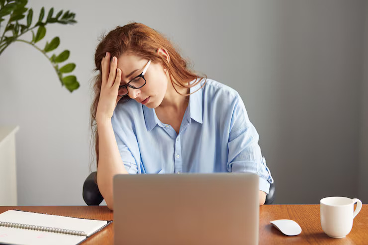 Stressed researcher working on thesis deadlines and academic documents